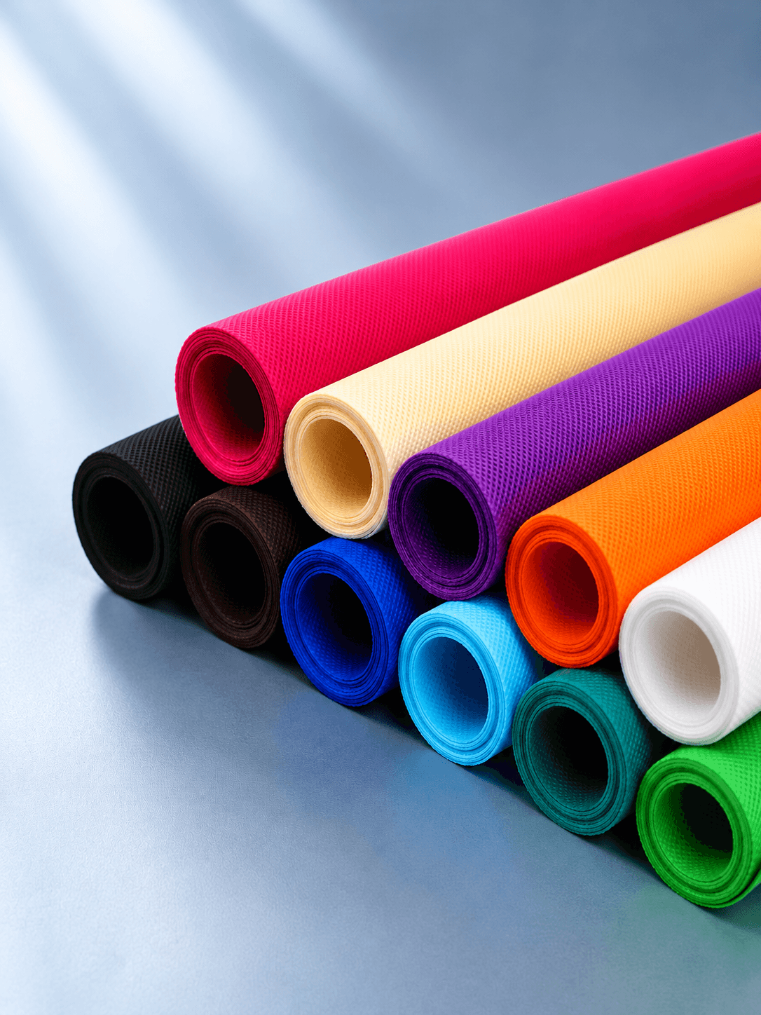 Rainbow stack of rolled spunbond non-woven fabric